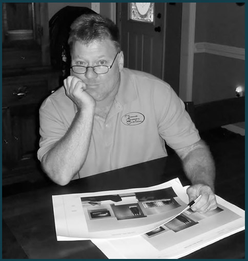 Thomas Jones, owner, reviewing details of showroom planning.